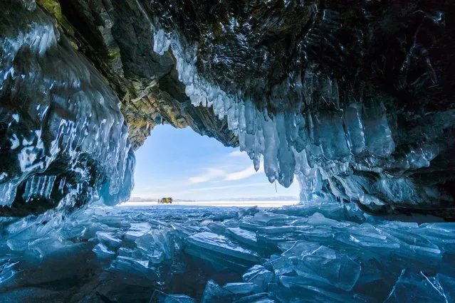 An ice cave in Lake Baikal, Russia. The gold winner in the people and nature category. (Photo by Sabrina Inderbitzi/World Nature Photography Awards)