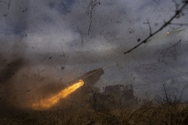 A Ukrainian MSLR BM-21 “Grad” of 95 Air Assault brigade fires towards Russian positions at the frontline near Kreminna, Ukraine, Thursday, March 9, 2023. (Photo by Evgeniy Maloletka/AP Photo)