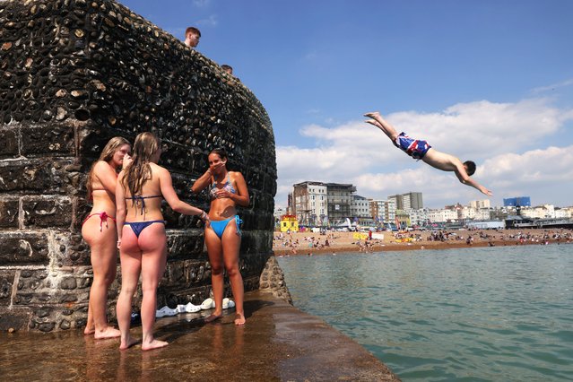 Brighton beach was the place to cool down as Britain basked in a long spell of warm weather on June 25, 2024. (Photo by Jack Hill/The Times)