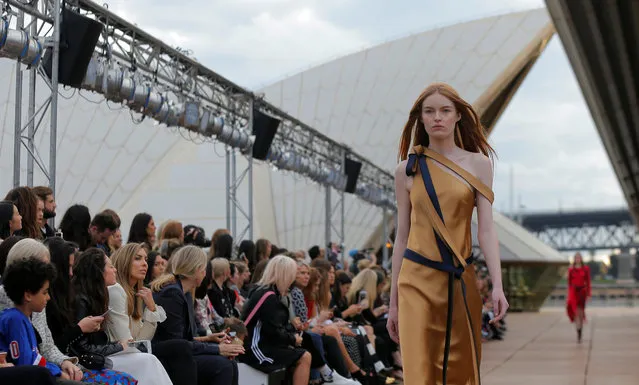 A model presents a creation for Australian designer Dion Lee during the first runway show of Fashion Week Australia on the steps of the Sydney Opera House, in Sydney on May 14, 2017. (Photo by Jason Reed/Reuters)