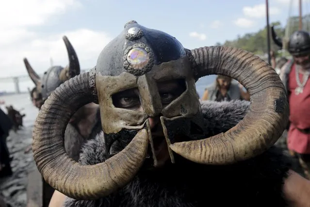 A man dressed up as a Viking shouts during the annual Viking festival of Catoira in north-western Spain August 2, 2015. (Photo by Miguel Vidal/Reuters)