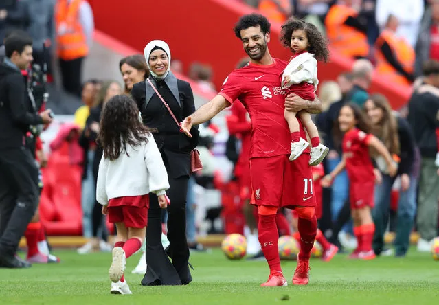 Mohamed Salah of Liverpool reacts on the pitch with family following the Premier League match between Liverpool and Wolverhampton Wanderers at Anfield on May 22, 2022 in Liverpool, England. (Photo by Alex Livesey/Getty Images)