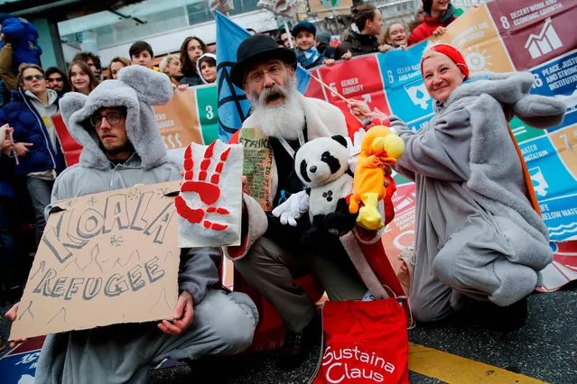 Protesters dressed as koalas demonstrate during a climate strike against governmental inaction towards climate breakdown and environmental pollution in Lausanne, on January 17, 2020. Swedish climate campaigner Greta Thunberg joined several thousand protesters in the streets of the Swiss city of Lausanne, days before the start of the Davos summit of the world's political and business elites. (Photo by Stefan Wermuth/AFP Photo)