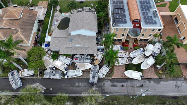 In this aerial view, boats are piled up in front of homes after Hurricane Helene hit the area as it passed offshore on September 28, 2024 in Treasure Island, Florida. Hurricane Helene made landfall Thursday night in Florida's Big Bend with winds up to 140 mph and storm surges that killed at least 42 people in several states. (Photo by Joe Raedle/Getty Images)