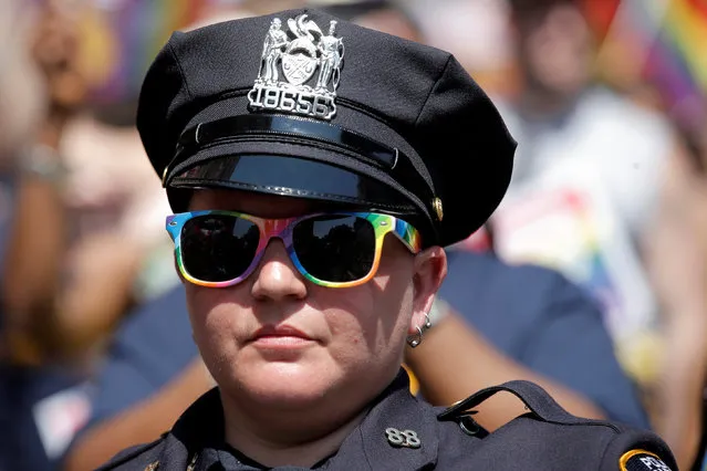 A New York City Police Department (NYPD) officer marches in the annual NYC Pride parade in New York City, New York, U.S., June 26, 2016. (Photo by Brendan McDermid/Reuters)