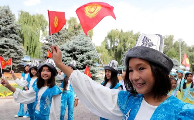 Kyrgyz children in national costumes during the 10th International Ethnic Festival in Bishkek, Kyrgyzstan, 07 July 2022. Children from Kyrgyzstan, Russia, Kazakhstan, Belarus participate in ethno festival with the main competitions being held on the Issyk-Kul lake. (Photo by Igor Kovalenko/EPA/EFE)