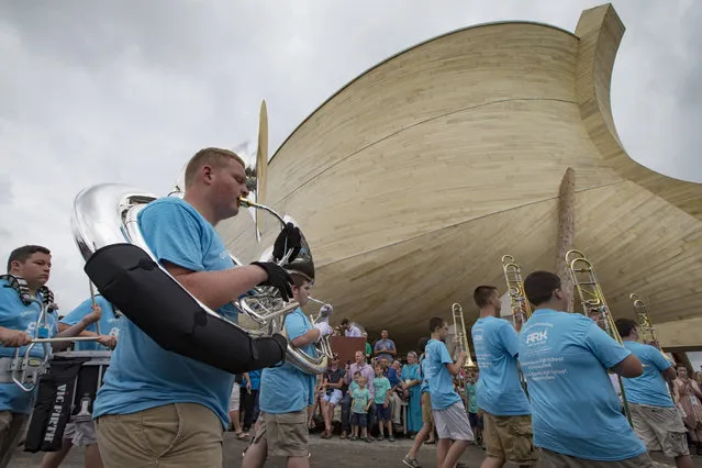 The Williamstown High School marching bad performs before a ribbon cutting to announce the opening of the Ark Encounter theme park during a media preview day, Tuesday, July 5, 2016, in Williamstown, Ky. The long-awaited theme park based on the story of a man who got a warning from God about a worldwide flood will debut in central Kentucky this Thursday. The Christian group behind the 510 foot-long wooden ark says it will demonstrate that the stories of the Bible are true. Its construction has rankled opponents who say the attraction will be detrimental to science education. (Photo by John Minchillo/AP Photo)