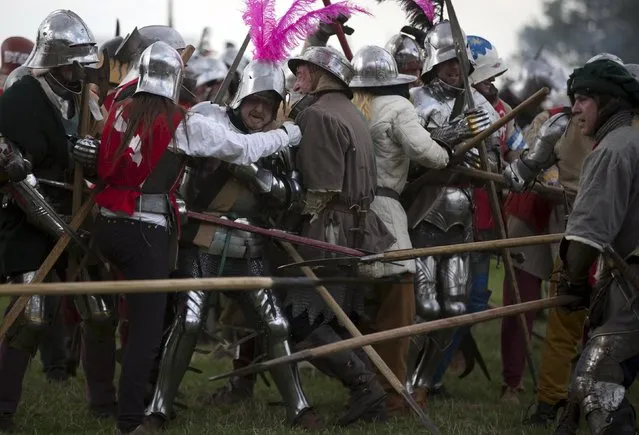 Historical re-enactors recreate a mock battle as part of an anniversary event for the Battle of Bosworth near Market Bosworth in central Britain August 22, 2015. (Photo by Neil Hall/Reuters)