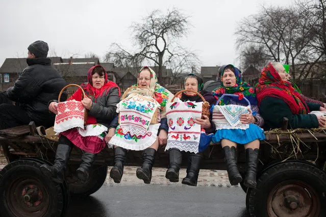 Local women in the village of Tonyezh in Belarus join the Chyrachka celebrations on March 10, 2019. The old custom celebrates spring and is associated with the arrival of a small waterfowl duck, which in this area is called “chyrachka”. (Photo by Radio Free Europe/Radio Liberty)