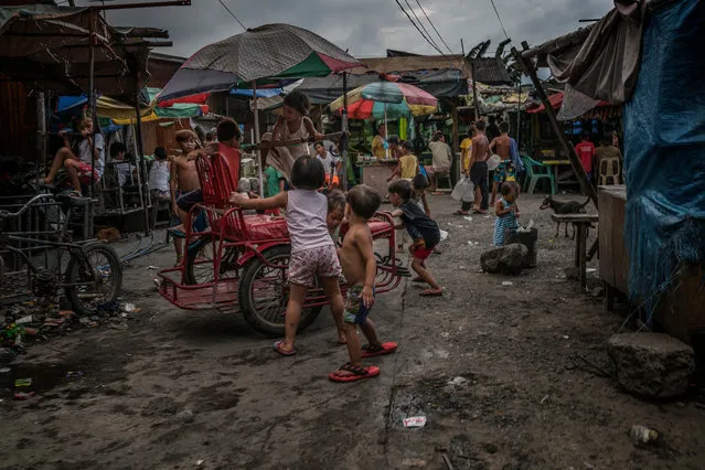 More than a fifth of the population in the Philippines lives below the poverty line. The strict Catholic country also has one of the highest birth rates in south-east Asia. More than 65% of women don’t use a modern form of contraceptive. In the shanty towns around Manila, poverty is ingrained. (Photo by James Whitlow Delano/Funded by the Pulitzer Center on Crisis Reporting/The Guardian)