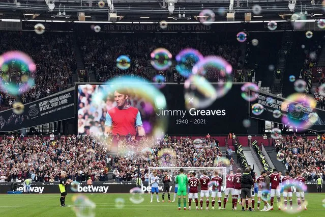 Bubbles float around The London Stadium as players and fans alike pay tribute to Jimmy Greaves who passed away earlier in the day ahead of the Premier League match between West Ham United and Manchester United at London Stadium on September 19, 2021 in London, England. (Photo by Charlotte Wilson/Offside/Offside via Getty Images)