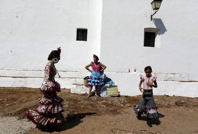 Pilgrims wearing traditional dresses take part during the Queen of Angeles pilgrimage in Alajar, southern Spain, September 8, 2015. (Photo by Marcelo del Pozo/Reuters)