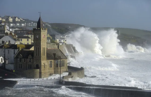 Waves break around the church in the harbour at Porthleven, Cornwall southwestern England, as the remnants of Hurricane Ophelia begins to hit parts of Britain and Ireland. Ireland's meteorological service is predicting wind gusts of 120 kph to 150 kph (75 mph to 93 mph), sparking fears of travel chaos. Some flights have been cancelled, and aviation officials are warning travelers to check the latest information before going to the airport Monday. (Photo by Ben Birchall/PA Wire via AP Photo)