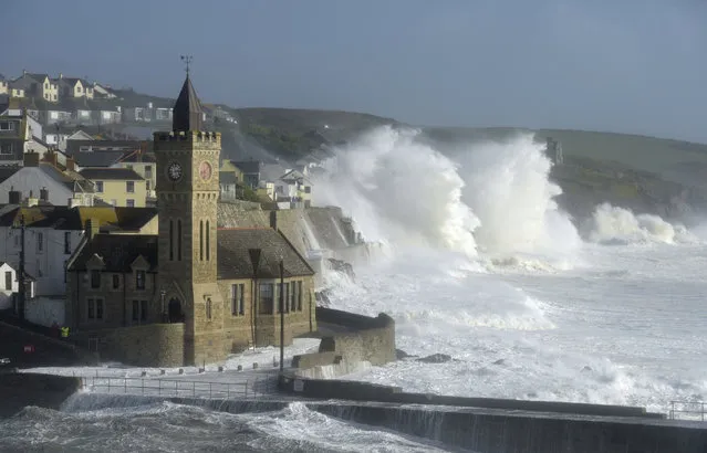 Waves break around the church in the harbour at Porthleven, Cornwall southwestern England, as the remnants of  Hurricane Ophelia begins to hit parts of Britain and Ireland. Ireland's meteorological service is predicting wind gusts of 120 kph to 150 kph (75 mph to 93 mph), sparking fears of travel chaos. Some flights have been cancelled, and aviation officials are warning travelers to check the latest information before going to the airport Monday. (Photo by Ben Birchall/PA Wire via AP Photo)