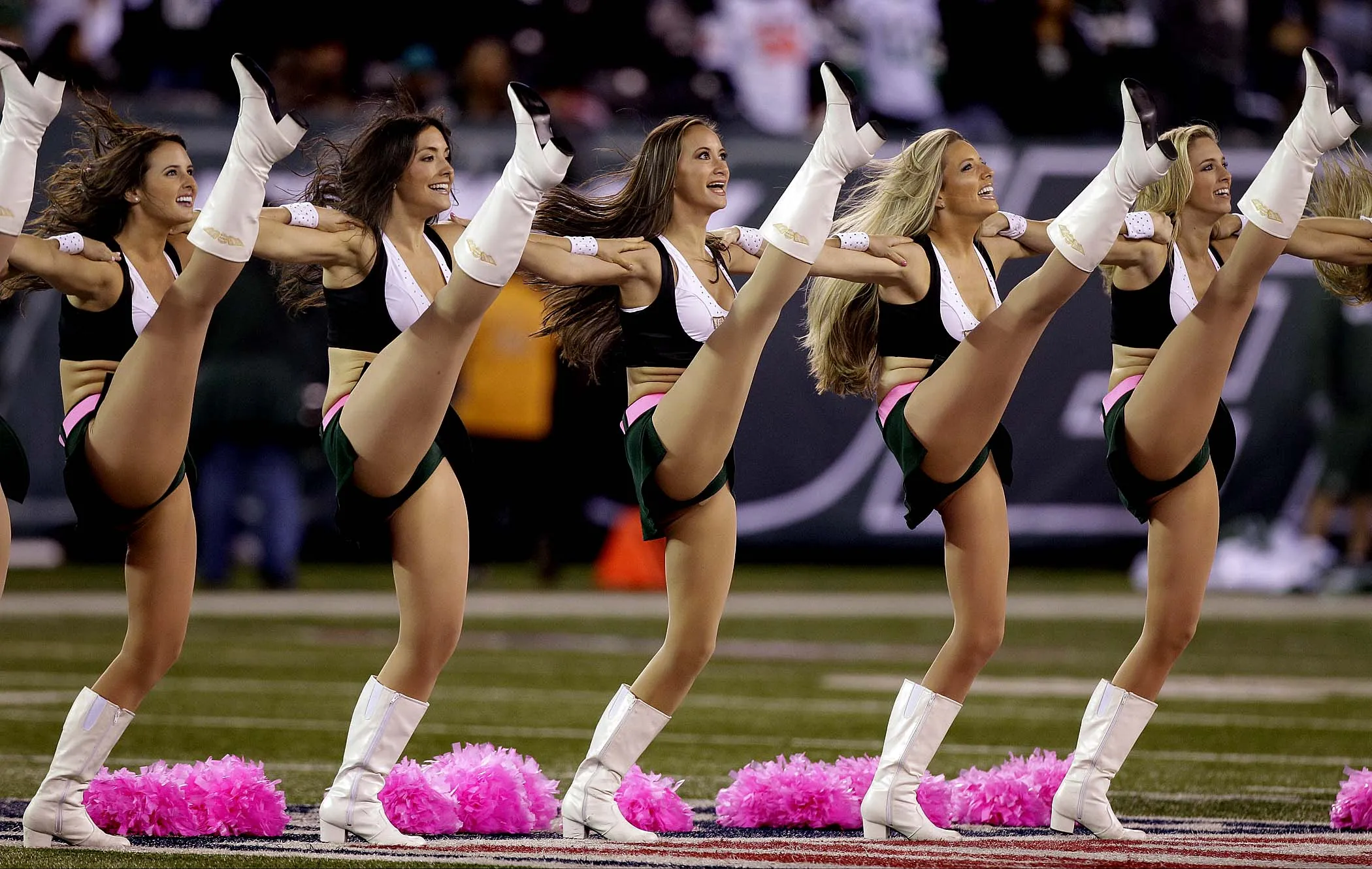 Next picture →. New York Jets cheerleaders use pink