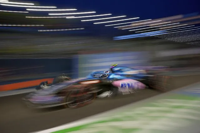 Alpine driver Esteban Ocon of France drives his car during practice of the Singapore Formula One Grand Prix, at the Marina Bay City Circuit in Singapore, Friday, Sepember. 30, 2022. (Photo by Vincent Thian/AP Photo)
