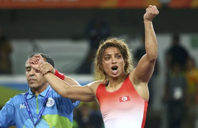 2016 Rio Olympics, Wrestling, Final, Women's Freestyle 58 kg Bronze, Carioca Arena 2, Rio de Janeiro, Brazil on August 17, 2016. The referee raises the hand of Maroua Amri (TUN) of Tunisia after her victory over Yulia Ratkevich (AZE) of Azerbaijan. (Photo by Ruben Sprich/Reuters)