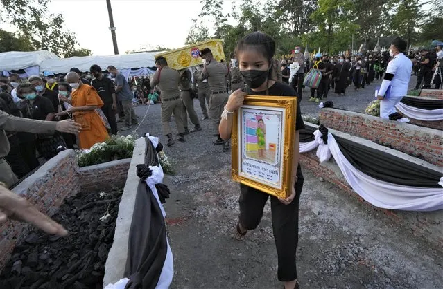 Funeral pyres are prepared for victims in the day care center attack at Wat Rat Samakee temple in Uthai Sawan, northeastern Thailand, Tuesday, October 11, 2022. (Photo by Sakchai Lalit/AP Photo)