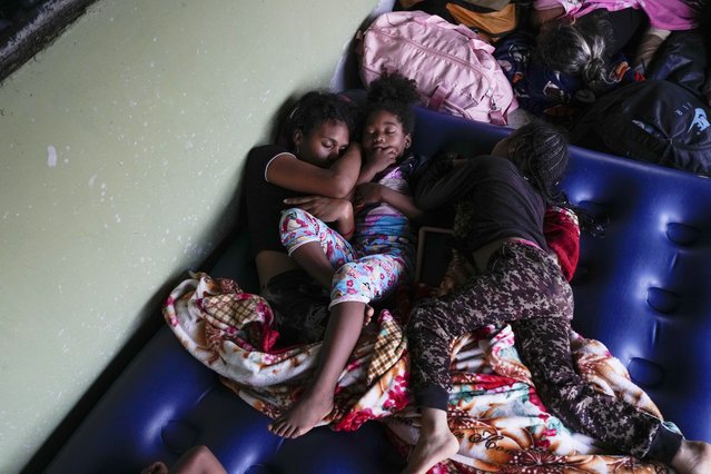 Venezuelan migrant Estebani Llerena, left, sleeps next to her daughter in Puerto Cartí, on Panama's Caribbean coast, Sunday, February 23, 2025, where they plan to take a boat to Colombia after giving up hopes of reaching the U.S. while in southern Mexico amid President Trump's crackdown on migration. (Photo by Matias Delacroix/AP Photo)