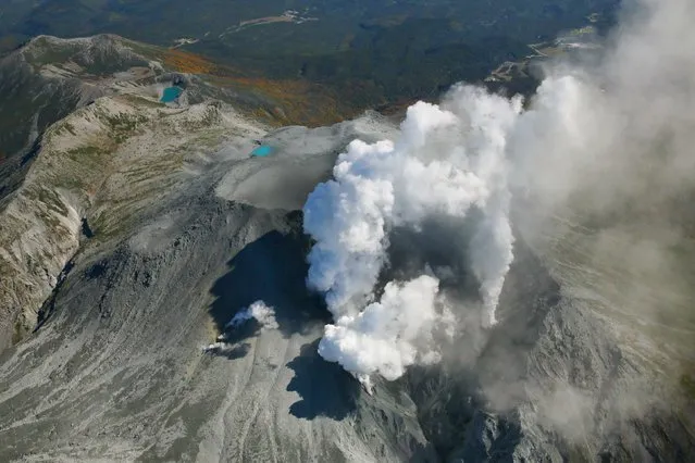 Volcanic smoke rises from Mount Ontake, which straddles Nagano and Gifu prefectures, central Japan, September 29, 2014, in this photo taken and released by Kyodo. More than 500 rescuers in Japan resumed searching on Monday for victims of the volcano that erupted without warning at the weekend, leaving four confirmed dead and 27 presumed to have perished in a sudden rain of ash and stone. (Photo by Reuters/Kyodo News)