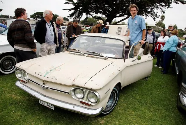 David Swan poses with his 1964 Chevrolet Corvair 500 during the Concours d'LeMons in Seaside, California, U.S. August 20, 2016. (Photo by Michael Fiala/Reuters/Courtesy of The Revs Institute)