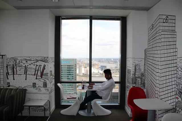 A man uses a laptop in the Level39 FinTech hub based in the One Canada Square tower of the Canary Wharf district of London, Britain, August 5, 2016. (Photo by Jemima Kelly/Reuters)