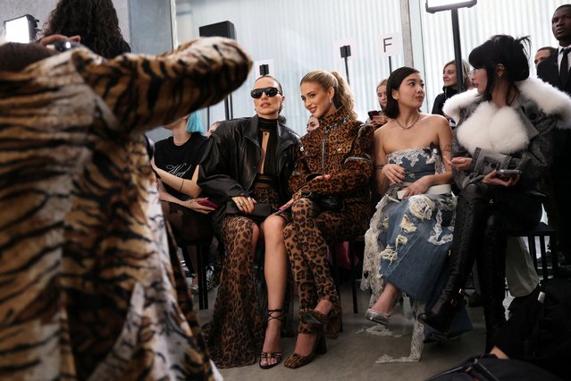 People pose before the Blumarine Fall/Winter 2025/2026 collection during Fashion Week in Milan, Italy, on February 27, 2025. (Photo by Claudia Greco/Reuters)