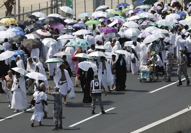 Pilgrims walk on a road in Mina, near the holy city of Mecca September 24, 2015. (Photo by Ahmad Masood/Reuters)