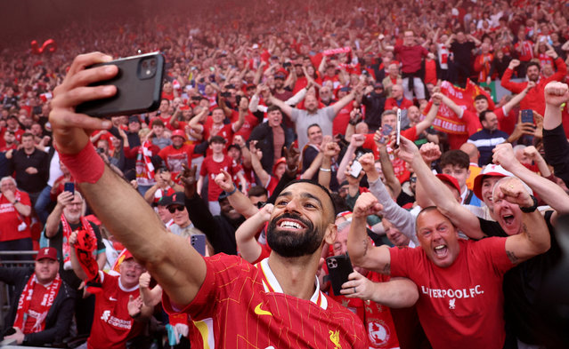 Mohamed Salah took a victory selfie with Liverpool fans after the team beat Tottenham Hotspur at Anfield to win the Premier League in Liverpool, Britain on April 27, 2025. (Photo by Phil Noble/Reuters)