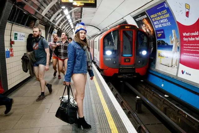 Passengers wear no trousers as they ride the London Underground in London, Britain, 07 January 2018. (Photo by Tolga Akmen/EPA/EFE)