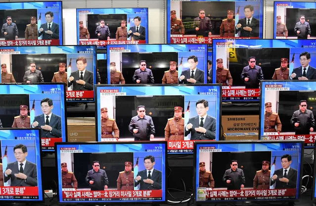 Television screens show a news report about the latest North Korean missile launch with file footage of North Korean leader Kim Jong Un, at an electronic market in Seoul on November 3, 2022. North Korea fired one long-range and two short-range ballistic missiles on November 3, Seoul's military said, with one prompting warnings for residents of a South Korean island and people in parts of northern Japan to seek shelter. (Photo by Jung Yeon-je/AFP Photo)