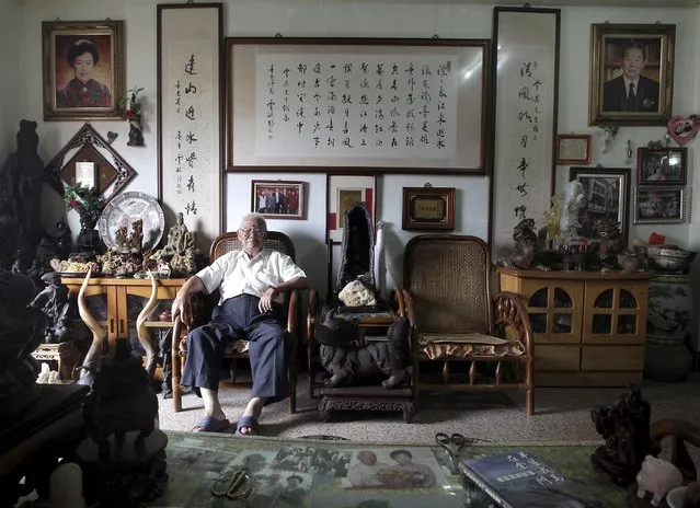 Huang Chin-chi, 92, poses for a photograph in his living room in Kinmen county, Taiwan, September 7, 2015. (Photo by Pichi Chuang/Reuters)