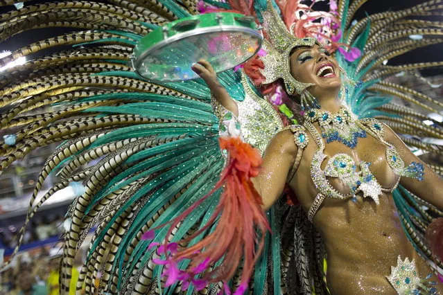 Maria Caren Paz,  from Argentina,  from the Mangueira samba school parades during carnival celebrations at the Sambadrome in Rio de Janeiro, Brazil, Monday, February 11, 2013. (Photo by Felipe Dana/AP Photo)