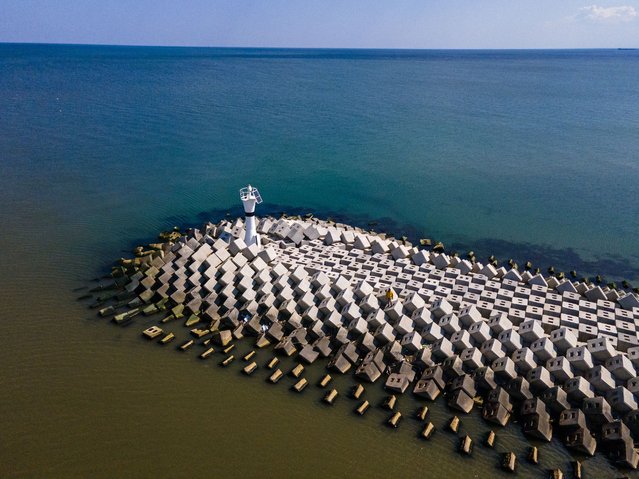 A view of Sakarya Karasu Lighthouse, which was reinforced with concrete blocks to protect against coastal erosion with the effect of north winds, in Karasu district of Sakarya, Turkiye on April 15, 2025. (Photo by Seyit Konyali/Anadolu via Getty Images)