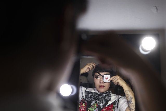Mexican designer Italia Segovia, 26, known as Kumiko, puts on an eye-patch from her brand Chicanjuku, a fusion of Mexican-American Chicano culture and Japanese Harajuku style, at home in Nezahualcoyotl, Mexico, on April 29, 2025. (Photo by Raquel Cunha/Reuters)