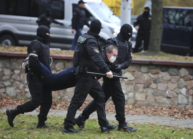 Police detain a man during an opposition rally to protest the official presidential election results in Minsk, Belarus, Sunday, November 1, 2020. (Photo by AP Photo/Stringer)
