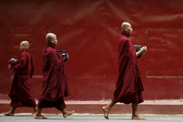 Buddhist monks walk inside the Masoyein monastery complex in Mandalay October 7, 2015. (Photo by Jorge Silva/Reuters)