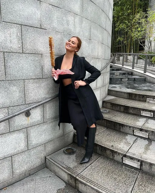 American model and television personality Chrissy Teigen in the last decade of March 2023 finally tries a Korean corn dog. (Photo by chrissyteigen/Instagram)