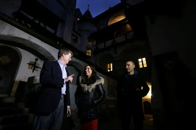 Tami and Robin Varma are greeted by Dacre Stoker, great-grand nephew of Dracula Gothic novel writer Bram Stoker, inside the courtyard of Bran Castle, in Brasov county, Romania, October 31, 2016. (Photo by Octav Ganea/Reuters/Inquam Photos)