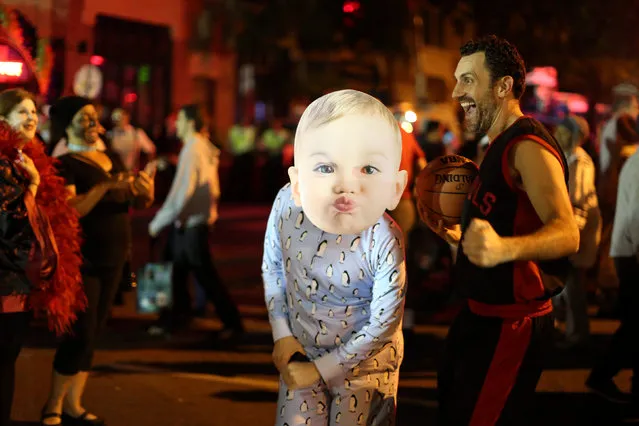 A man dressed as a baby dances at the West Hollywood Halloween Carnaval in West Hollywood, California October 31, 2016. (Photo by David McNew/Reuters)