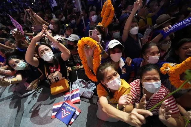 Supporters of Thailand's Prime Minister Prayuth Chan-ocha cheer, during a final general election campaign rally in Bangkok, Thailand, Friday, May 12, 2023. Thailand votes Sunday in an election many see as an opportunity to break free from military-led governments that have been in power for almost a decade. (Photo by Sakchai Lalit/AP Photo)
