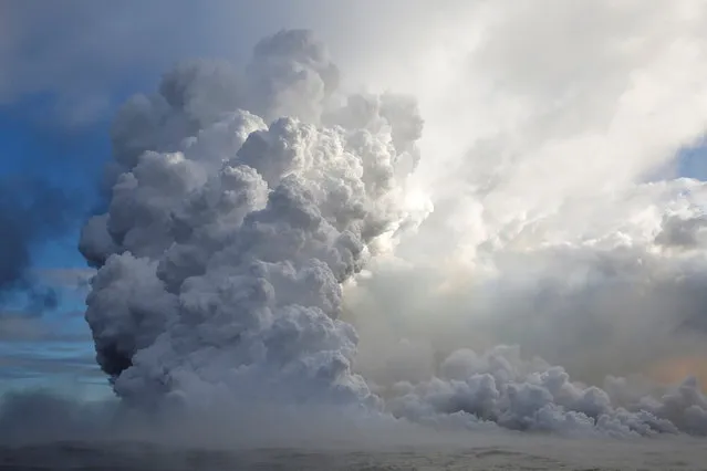 Lava flows into the Pacific Ocean in the Kapoho area, east of Pahoa, during ongoing eruptions of the Kilauea Volcano in Hawaii, U.S., June 4, 2018. (Photo by Terray Sylvester/Reuters)