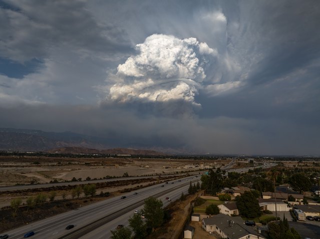 In an aerial view, a massive plume is seen growing over the Line Fire during its 4,000-foot elevation climb up to the edge of the mountain community of Running Springs before being temporarily halted by a sudden a late-season monsoon rain storm on September 7, 2024 in San Bernardino, California. Thousands of people fled the fire, which began at the foothill city of Highland in heatwave conditions. It has grown to 17,459 acres and remains 0 percent contained.  (Photo by David McNew/Getty Images)