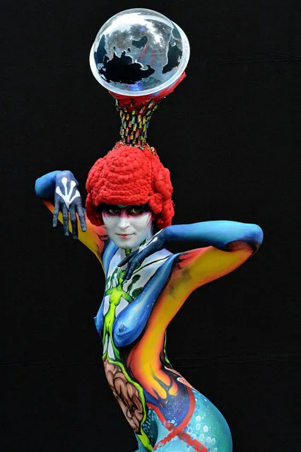 A participant poses with her body paintings designed by bodypainting artist Min Ah Kim during the 16th World Bodypainting Festival on July 5, 2013 in Poertschach am Woerthersee, Austria. (Photo by Didier Messens/Getty Images)