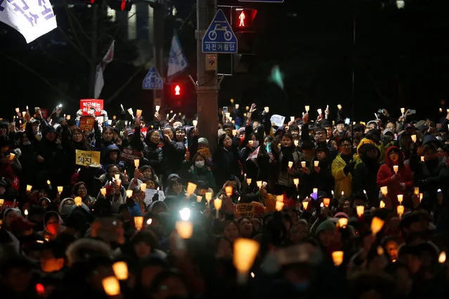 People attend a protest calling for Park Geun-hye to step down in central Seoul, South Korea, November 26, 2016. (Photo by Kim Kyung-Hoon/Reuters)