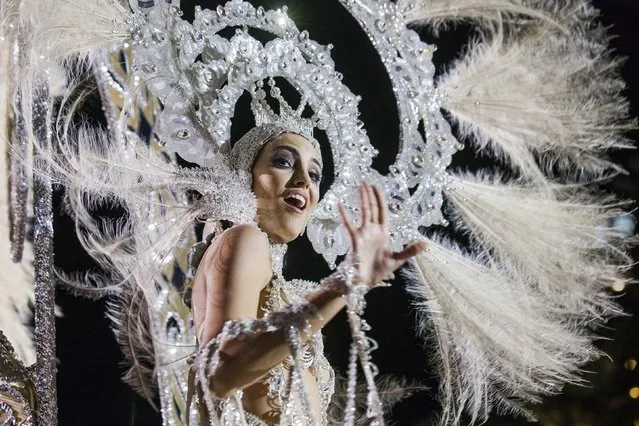Aranzazu Estevez, wearing a creation called “La princesa de las mil rosas” (the princess a thousand roses), performs on stage during the Carnival Queen ceremony in Las Palmas, capital of the Spanish Canary Island of Gran Canaria, February 13, 2015. (Photo by Borja Suarez/Reuters)