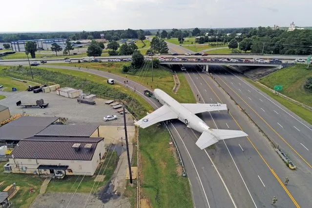 A giant aircraft rolls into retirement with police and military closing roads and highways. The Northrop Grumman E-8C Joint STARS aircraft, used for airborne ground surveillance and battle management, with a wingspan of over 44meters, was towed along the busy roads in Georgia, USA, to the state Museum of Aviation on August 2, 2023. The Air Force E-8C, serial number 00-2000, was towed three miles along parts of Georgia Highway 247 and Russell Parkway. The historic event took more than four hours to complete. (Photo by Thomas Geraldsen/US Air Force/Capture Media Agency)