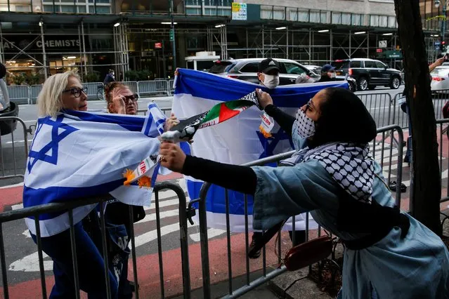 A Pro-Palestinian supporter argues with Israeli supporters during a protest near the Israeli Consulate following a flare-up of Israeli-Palestinian violence in the Manhattan borough of New York City, New York, U.S., May 11, 2021. (Photo by Eduardo Munoz/Reuters)