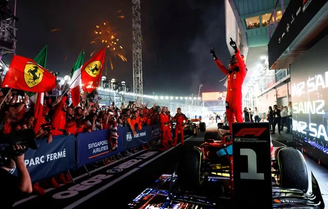 Ferrari's Carlos Sainz Jr celebrates after winning the Singapore Grand Prix at Marina Bay Street Circuit on September 17, 2023. (Photo by Edgar Su/Reuters)