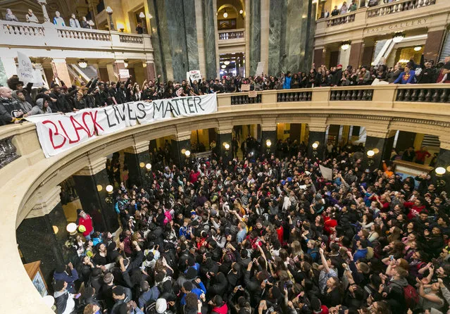 Demonstrators protest the shooting of Tony Robinson at the state Capitol Monday, March 9, 2015, in Madison, Wis. Robinson, 19, was fatally shot Friday night by a police officer who forced his way into an apartment after hearing a disturbance while responding to a call. Police say Robinson had attacked the officer. (AP Photo/Andy Manis)